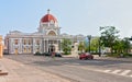 Town hall of Cienfuegos city at Jose Marti park with some locals Royalty Free Stock Photo