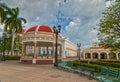 Town hall of Cienfuegos city at Jose Marti park with some locals Royalty Free Stock Photo