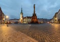 Town hall and Holy Trinity Column in Olomouc after sunset.