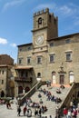 Town hall with tourists in Cortona Italy Royalty Free Stock Photo