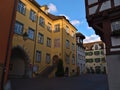 Town hall with yellow facade at square in the historic center surrounded by old half-timbered houses in Christmas with decoration.