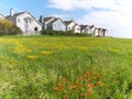 Town houses on green meadow Royalty Free Stock Photo