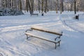 Manor Park in IÃâowa in winter. Park bench covered with snow. Royalty Free Stock Photo