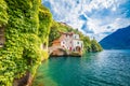 Town of Nesso historic stone bridge and scenic lakefront view Royalty Free Stock Photo