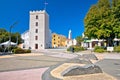 Town of Novi Vinodolski tower and old stone square view