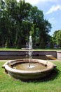 Attractions of the Peterhof Museum-reserve.Small round fountains are installed along the `Sea channel`.