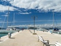 Town pier in Zlarin island in Croatia, port marine with yachts and catamarans