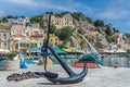 Town promenade with anchor sculpture, Symi, Greece