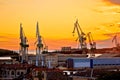 Town of Pula shipyard cranes sunset view Royalty Free Stock Photo