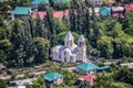 The town of Sachkhere Georgia with typical red and green metal roofed houses and an orthodox church in the center Royalty Free Stock Photo