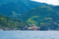 The town of Vernazza, one of the five small towns in the Cinque Terre national Park, Italy. View from the excursion ship. Royalty Free Stock Photo