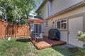 View of a small backyard with wooden deck