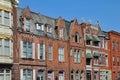 Townhouses with gables and brownstone trim