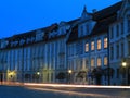 Moving traffic in old town by twilight Royalty Free Stock Photo