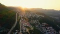 Townscape and mountains against sky during sunset. Royalty Free Stock Photo