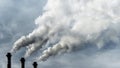 Toxic emissions of toxic gases into the atmosphere, industrial air pollution. Dark chimneys blowing huge billows of