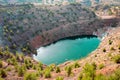 Toxic lake in open pit of abandoned copper mine