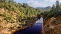 Toxic red lake at abandoned open-pit copper mine