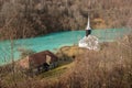 Toxic waste waters from a copper and gold mine submerge village. Abandoned orthodox church on lakeside