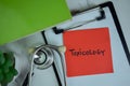 Toxicology write on sticky notes isolated on Wooden Table