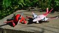 Toy aircrafts from Disney Pixar movie Planes, El Chupacabra and Rochelle, standing on concrete block as on small airfield