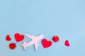 Toy airplane on blue table with red heart Royalty Free Stock Photo