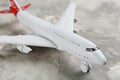 Toy airplane on grey background, closeup view