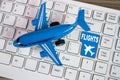 Toy airplane on keyboard online booking or purchase of plane tic Royalty Free Stock Photo
