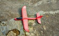 Toy airplane made of styrofoam on a natural stone as a travel concept for flights for children