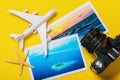 Toy airplane, vacation photos, and camera on a yellow background. Travel concept
