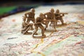 Toy army men on a map Royalty Free Stock Photo