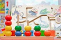 Pyramid build from colored wooden rings. Toy for babies and toddlers to joyfully learn mechanical skills and colors and numbers. b Royalty Free Stock Photo