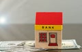 Toy bank building on US dollar assets Royalty Free Stock Photo