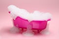 Toy bathtub overflowing with foam on pink background Royalty Free Stock Photo