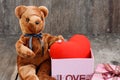 Toy bear doll and the jewelry ring with red heart Royalty Free Stock Photo