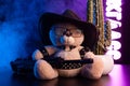 toy bear with glasses and a cowboy hat on a leather belt accessory for BDSM games gift