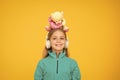 A toy bear hug for you. Happy small child hold soft toy on head. Little girl smile with valentines toy. Teddy bear with