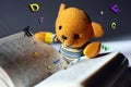 Toy bear reading