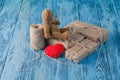 Toy bear and some paper parcels wrapped on wooden table