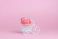 A toy bike carries a gift. The idea for a postcard Royalty Free Stock Photo