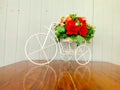 Toy bike decorated with flowers Royalty Free Stock Photo