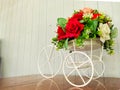 Toy bike decorated with flowers Royalty Free Stock Photo