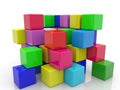 Toy blocks of different colors are stacked on top of each other on white Royalty Free Stock Photo