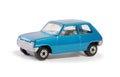 Toy blue model seventies french hatchback on white
