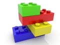 Toy bricks of different colors and sizes are stacked on top of each other Royalty Free Stock Photo