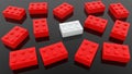 Toy bricks in red and white colors on black Royalty Free Stock Photo