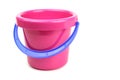 Toy bucket pink with blue handle isolated on white Royalty Free Stock Photo