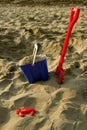 Toy Bucket and Spade on Beach Royalty Free Stock Photo