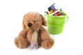 Toy bucket and toy bear Royalty Free Stock Photo