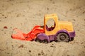 Toy Bulldozer in the sand. A small digger Royalty Free Stock Photo